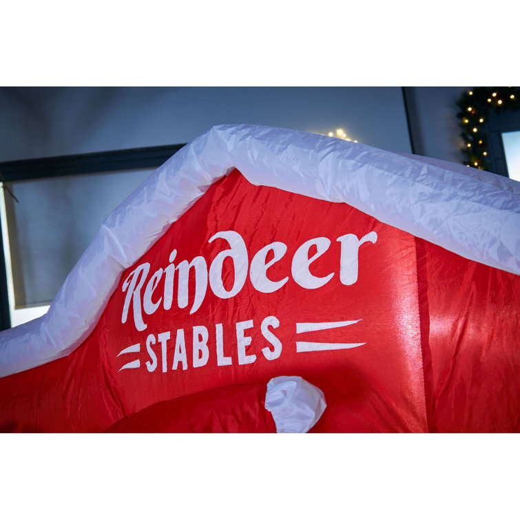 The Seasonal Aisle Santa and Reindeer Stables Inflatable Wayfair.co.uk
